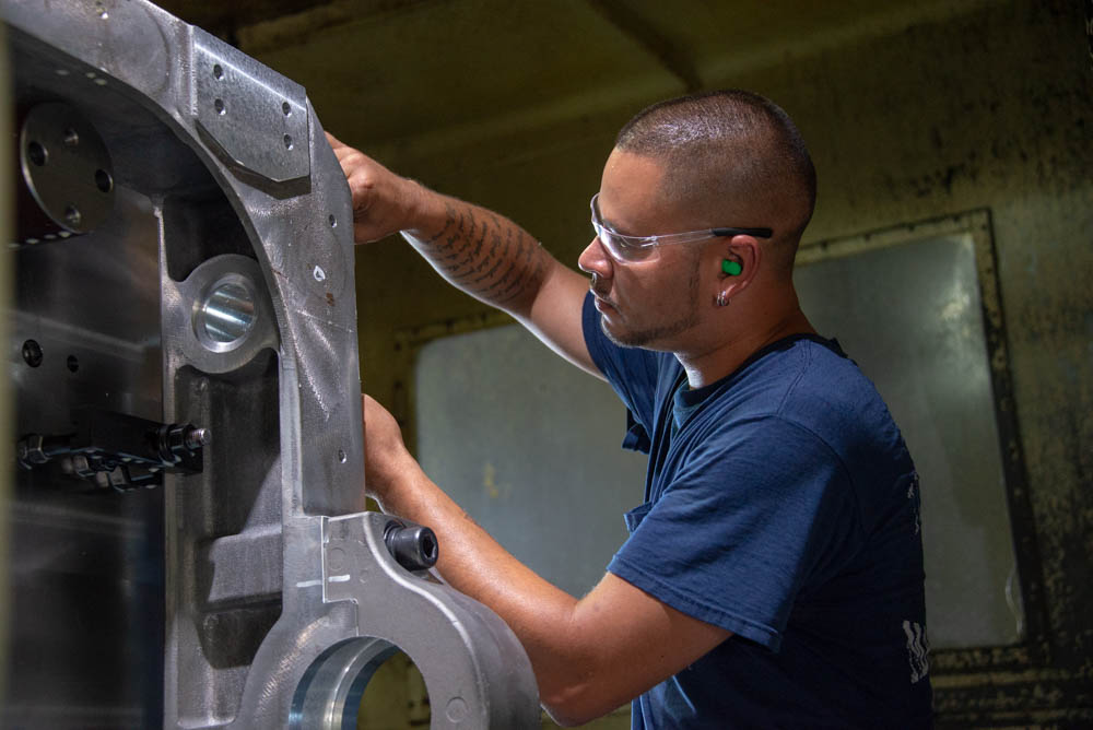 flinchbaugh employee working with a machined part